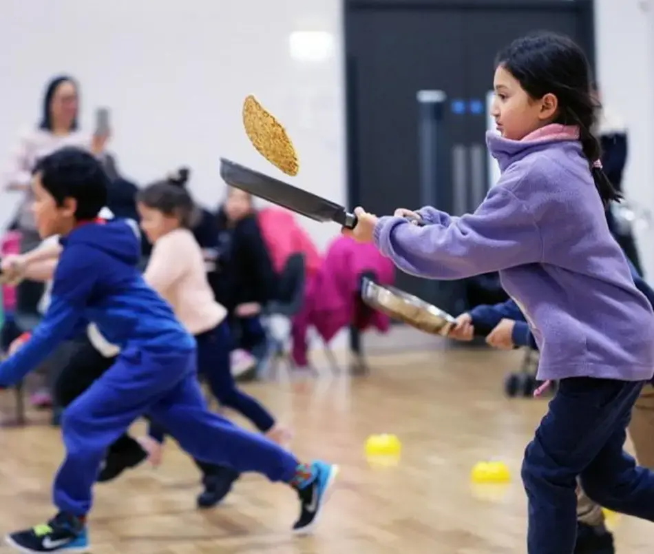 New Community celebrate Pancake Day at Ermine Street Church Academy